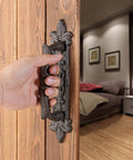 Heavy Duty 8.9 Inch Barn Door Handles 2 Pack In Rust Color Cast Iron Rustic Vintage Look installed on wooden door