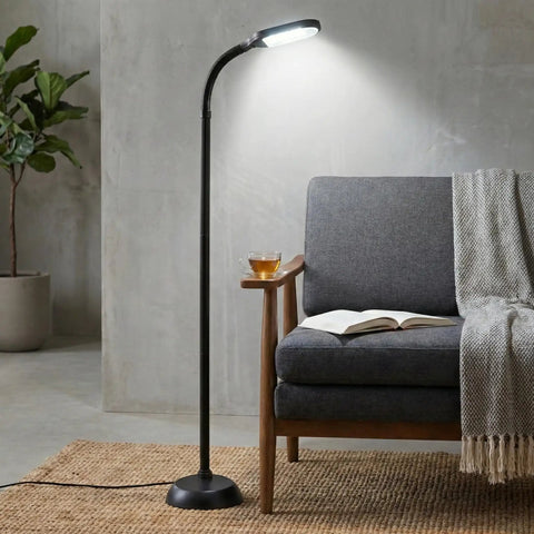 Adjustable Floor Lamp With Full Spectrum Natural Sunlight For Reading, Craft, And Studying next to grey chair in modern living room
