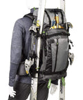 BackLight Elite 45L Camera Daypack For DSLR And Mirrorless Gear, Photo And Video Ready, Rugged Grey, side view with ski gear