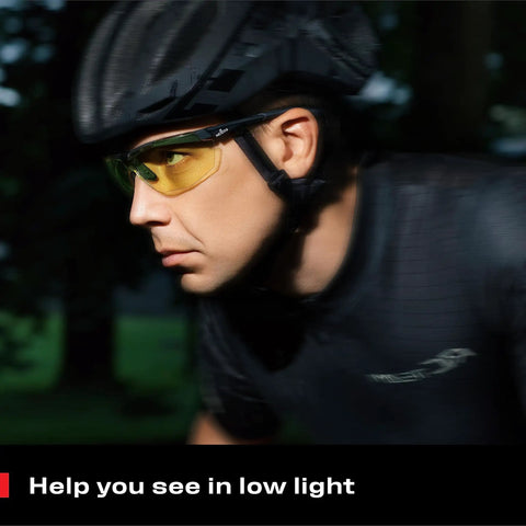 Man cycling at dusk wearing Yellow Safety Glasses For Men, ANSI Z87 Rated Shooting Eyewear With Scratch And Fog Resistant Lenses.