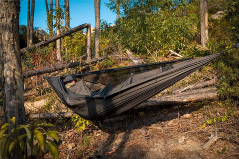 Kompound Camping Hammock With Net And Warm Internal Cover Ultralight Portable Hammock With Tree Friendly Straps set up in the forest