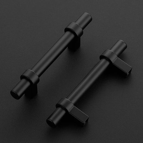 Two matte black cabinet pulls with square bases on a black surface, part of the 30 Pack Matte Black 5 Inch Cabinet Pulls With Square Base