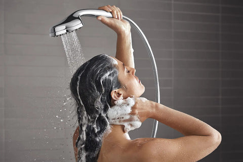 Person using All In One Handheld And Docked Showerhead With Full Coverage Angled Nozzles For An Intense Rinse And Easy Switch Between Modes