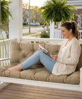 Woman reading on porch swing with replacement cushions for outdoor furniture 60x40 inch waterproof porch bench cushions for 2 to 3 seaters with ties and backrest 5 inch thick patio swing chair cushion for garden backyard easy to clean and breathable khaki