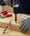 Person using power drill to install Wood Threaded Inserts Kit Brass M3-0.5 Knife Thread Inserts 10 Pack in wooden block.