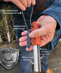 Person holding All Weather Survival Fire Starter With Magnesium Ferro Rod And Euro Ferrocerium, showing paracord and striker