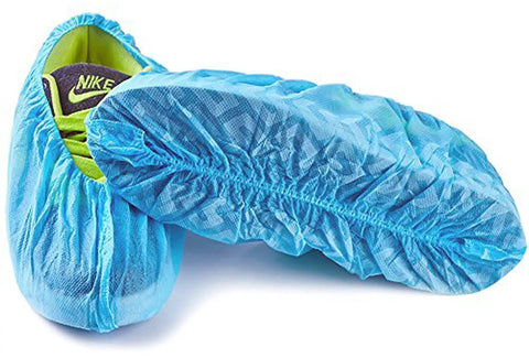Heavy Duty Waterproof Disposable Shoe Covers With Elastic Band And Non Slip Silicone Sole For Floor Protection Blue XL 100 Pack Fits Men Size 11 And Women Size 13 For Home And Work, showing bottom view of shoe covers over a sneaker.