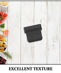Black rubber steam wand cover for espresso machines on wooden table