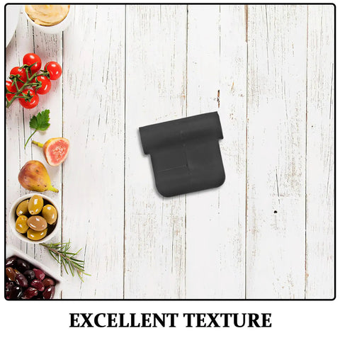 Black rubber steam wand cover for espresso machines on wooden table