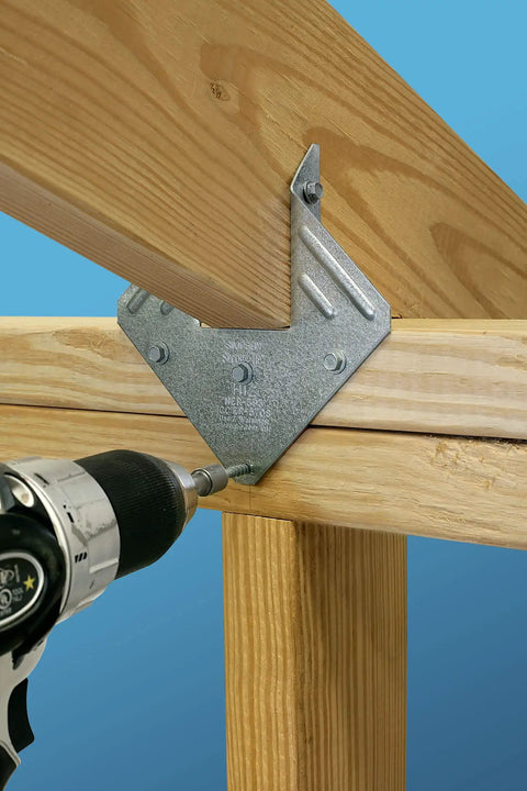Pro Level Hex Connector Screws With Galvanized Coating And Quick Drive Bit rigged for deck framing with a drill on wood framing.