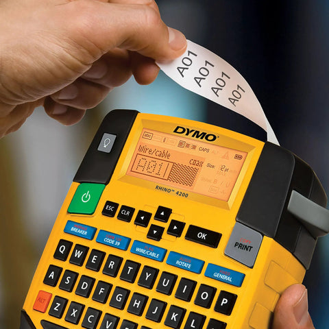 Close-up of hand using label maker with Rhino Industrial Flexible Nylon Labels Three Quarters Inch By Eleven Point Five Foot Black Print On White Tape
