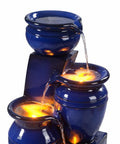Close-up of 4 Tier Cascading Solar Powered Water Fountain With Navy Finish Illuminated By LED Lights Outdoor Garden Water Feature
