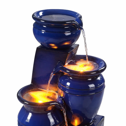 Close-up of 4 Tier Cascading Solar Powered Water Fountain With Navy Finish Illuminated By LED Lights Outdoor Garden Water Feature