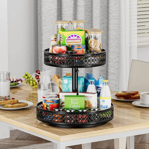 Two-tier black metal Lazy Susan turntable, 12-inch diameter, on kitchen counter; holds cans, boxes, and bottles.