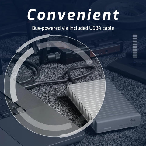 NVMe SSD Enclosure With USB4 Thunderbolt Compatibility, Aluminum Heat Sink next to laptop, showcasing bus-powered USB4 cable.