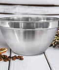 V Shaped 5 Qt Stainless Steel Mixing Bowl With Polished Finish Perfect For Baking Muffins Mixing Sauces And Melting Chocolate On A Double Boiler Durable Go To Kitchen Must Have For Home Cooks And Pros on rustic table with spices