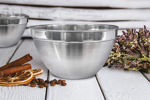 V Shaped 5 Qt Stainless Steel Mixing Bowl With Polished Finish Perfect For Baking Muffins Mixing Sauces And Melting Chocolate On A Double Boiler Durable Go To Kitchen Must Have For Home Cooks And Pros on rustic table with spices