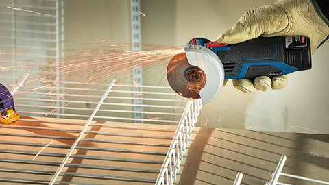 GWS12V-30N 12V Max Brushless 3 Inch Angle Grinder Bare Tool in use, cutting metal rod, sparks visible