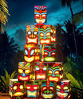 12 Pcs Hawaiian Luau Tiki Totem Gift Boxes With LED Lights For Outdoor Indoor Party Decor, arranged in a pyramid at night.