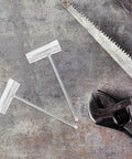 Heavy Duty Four Piece Chainsaw Wrench Socket Set With Bar Adjustment Tool, metallic tools on a textured background.