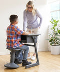 Child using SitWell Wobble Stool With Adjustable Height For Active Seating In Classrooms And Libraries, Promotes Core Strength.