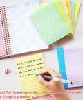 Person writing on yellow 4x6 inch lined sticky notes with pastel colors, part of 9 Pack 4x6 Inch Lined Sticky Notes With 35 Sheets Per Pad.