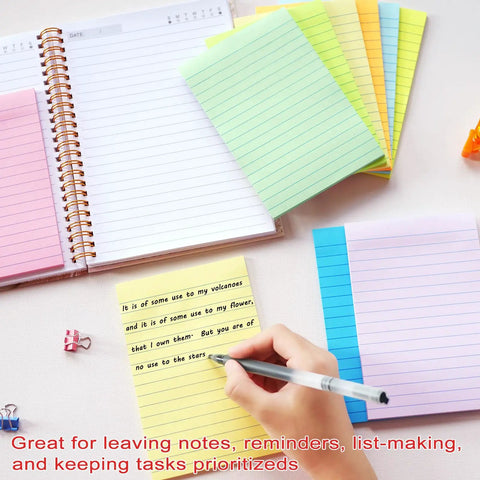 Person writing on yellow 4x6 inch lined sticky notes with pastel colors, part of 9 Pack 4x6 Inch Lined Sticky Notes With 35 Sheets Per Pad.
