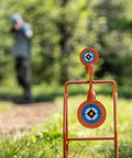 Double Paddle Spinner Shooting Target With 3 Inch And 4.5 Inch Spinning Targets, No Reset, Steel Four-Leg Stand, in use outdoors
