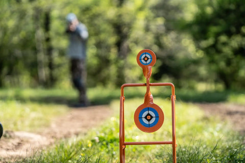 Double Paddle Spinner Shooting Target With 3 Inch And 4.5 Inch Spinning Targets, No Reset, Steel Four-Leg Stand, in use outdoors