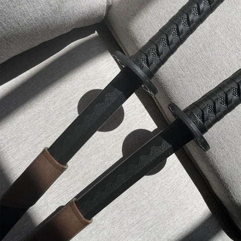 Ultra Tough 41 Inch Polypropylene Sword With ABS Scabbard For Theater Larp And Martial Arts Training Durable Blade Will Not Break Even When Bent Past 90 Degrees And Realistic Safe Scabbard For Easy Carry showing two swords side by side on fabric background