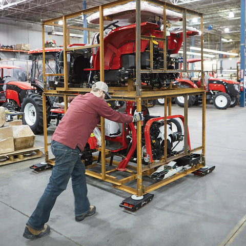 Worker using Heavy Duty Machinery Mover Dolly 26,400-Lb Capacity With 8 Rollers Equipment Skates in factory