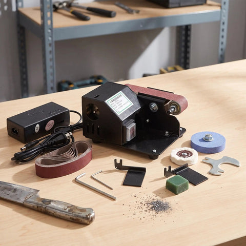 Compact Mini Electric Belt Sander With A Kickass Motor For Handheld Wood Sanding And Fast Metal Polishing Quick Rust Removal And Smooth DIY Finishes Built Like A Rock Solid Workhorse on a workbench.