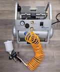 Pro Grade Lvlp Spray Gun Featuring Gravity Feed Reservoir Lightweight Aluminum Body Holds 20 Oz Cup Paired With Exact 1.3 Millimeter Nozzle To Serve Up Killer Smooth Finish For Garage And Auto Work connected to air compressor with orange hose