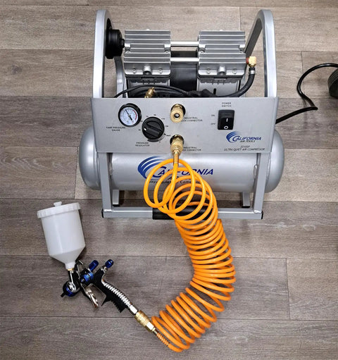 Pro Grade Lvlp Spray Gun Featuring Gravity Feed Reservoir Lightweight Aluminum Body Holds 20 Oz Cup Paired With Exact 1.3 Millimeter Nozzle To Serve Up Killer Smooth Finish For Garage And Auto Work connected to air compressor with orange hose
