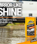 All In One Car Cleaning Kit With Wash And Wax Glass Wipes Tire Foam And Protectant Four Piece Auto Detailing Set bottle on wet surface