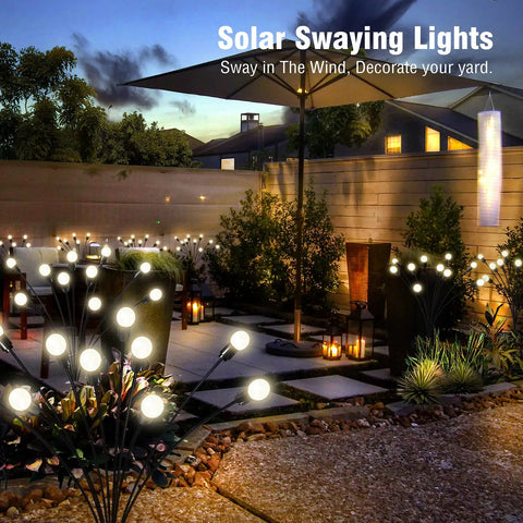 Two Pack 10 LED Solar Firefly Garden Lights Outdoor Waterproof Decorative Lamps in garden at night