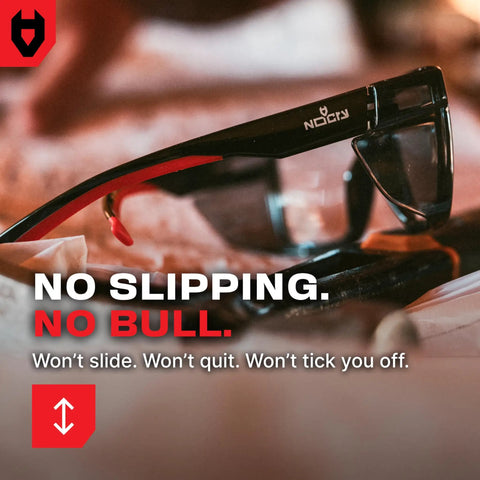 ANSI Z87.1 Clear Safety Glasses With Side Shields For Men And Women on a table, emphasizing secure fit with branding visible.