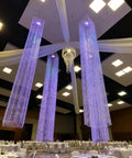 Four Tier Large Wedding Chandelier With Faux Crystal Iridescent Beaded Swag, 24 Inch Wide By 36 Inch Long in a decorated venue