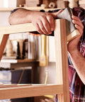 Craftsman using Pro Grade Wet And Dry Sandpaper Set Of 30 Grit Papers 2000 3000 5000 7000 10000 on wooden furniture