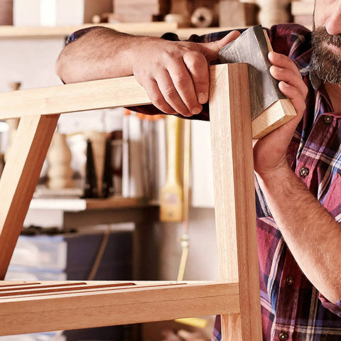 Craftsman using Pro Grade Wet And Dry Sandpaper Set Of 30 Grit Papers 2000 3000 5000 7000 10000 on wooden furniture