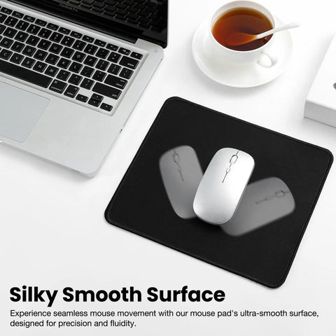 Stitched Edge Non Slip Rubber Mouse Pad For Laptop And PC Use Go To Desk Mat For Gaming Office And Home Black Square 9.8 Inches By 8.3 Inches By 0.08 Inches shown on a desk with a laptop and cup of tea.