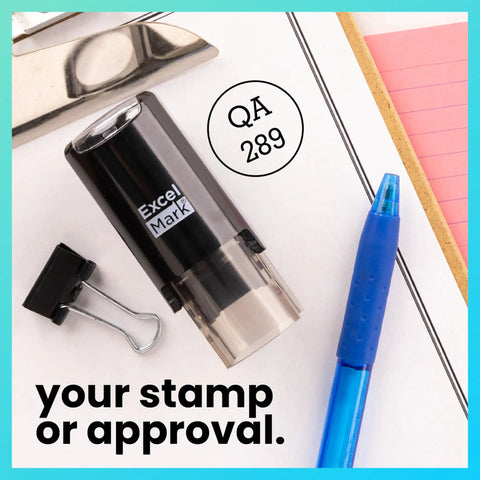 Self Inking Inspection Stamp Dual Line Layout For Swift Quality Control Checks on desk with pen and binder clip.