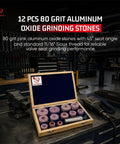 Open box of 12 pink 80 grit aluminum oxide stones for valve seat grinding, displayed in workshop setting.