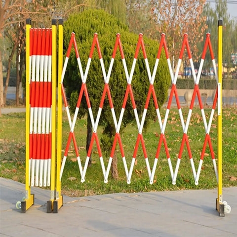 Built Like A Tank Retractable Traffic Barricade Featuring Smooth Glide Pulleys And A Quick Fold Stand For Snatch And Go Crowd Control Fencing Construction Sites in a park.