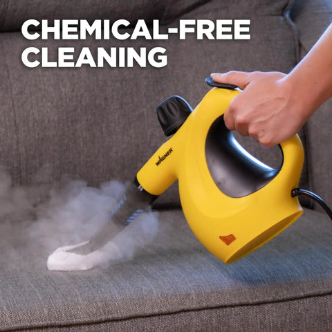 Heavy Duty Handheld Steam Cleaner Badass Chemical Free Deep Powerhouse With 11 Slick Nozzles For Kickin Grime Off Floors Carpets And Kid Safe Home Sanitizing Tools in use on a couch.