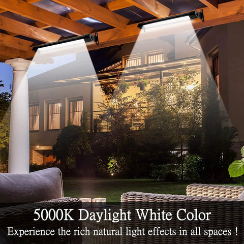 Two 2ft Outdoor Wall Washer Light Bar Pair 36W 5000K Daylight White LED illuminating a garden and building facade at night