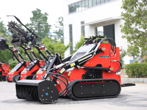 Stomp Mini Skid Steer Loader 1800lbs Compact Machine in a garden setting, ideal for digging and light construction projects