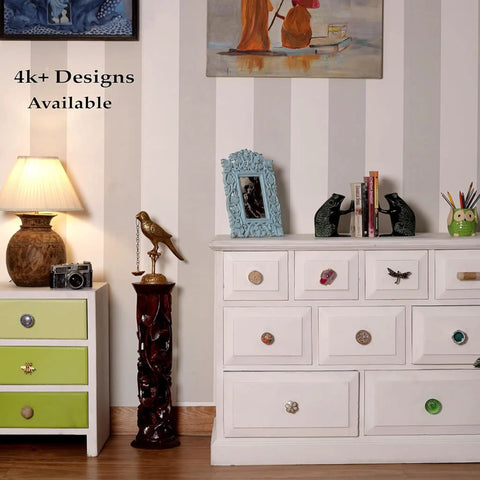 White dresser with Six Piece Cream Crackle Ceramic Cabinet Knobs Set For Drawers And Dressers, retro vibe in stylish room.