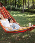 People relaxing in Ultra Lightweight Portable Camping Hammock For Backpacking Beach Patio And Backyard Durable Fabric Easy Setup