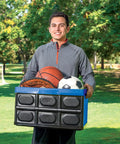 Heavy Duty Collapsible Storage Bin With 12 Gallon Capacity And Built In File Organizer Rails For Home Office Garage Car Trunk Folding Plastic Tote With Easy Grip Handles Black Blue carrying sports equipment in a park.